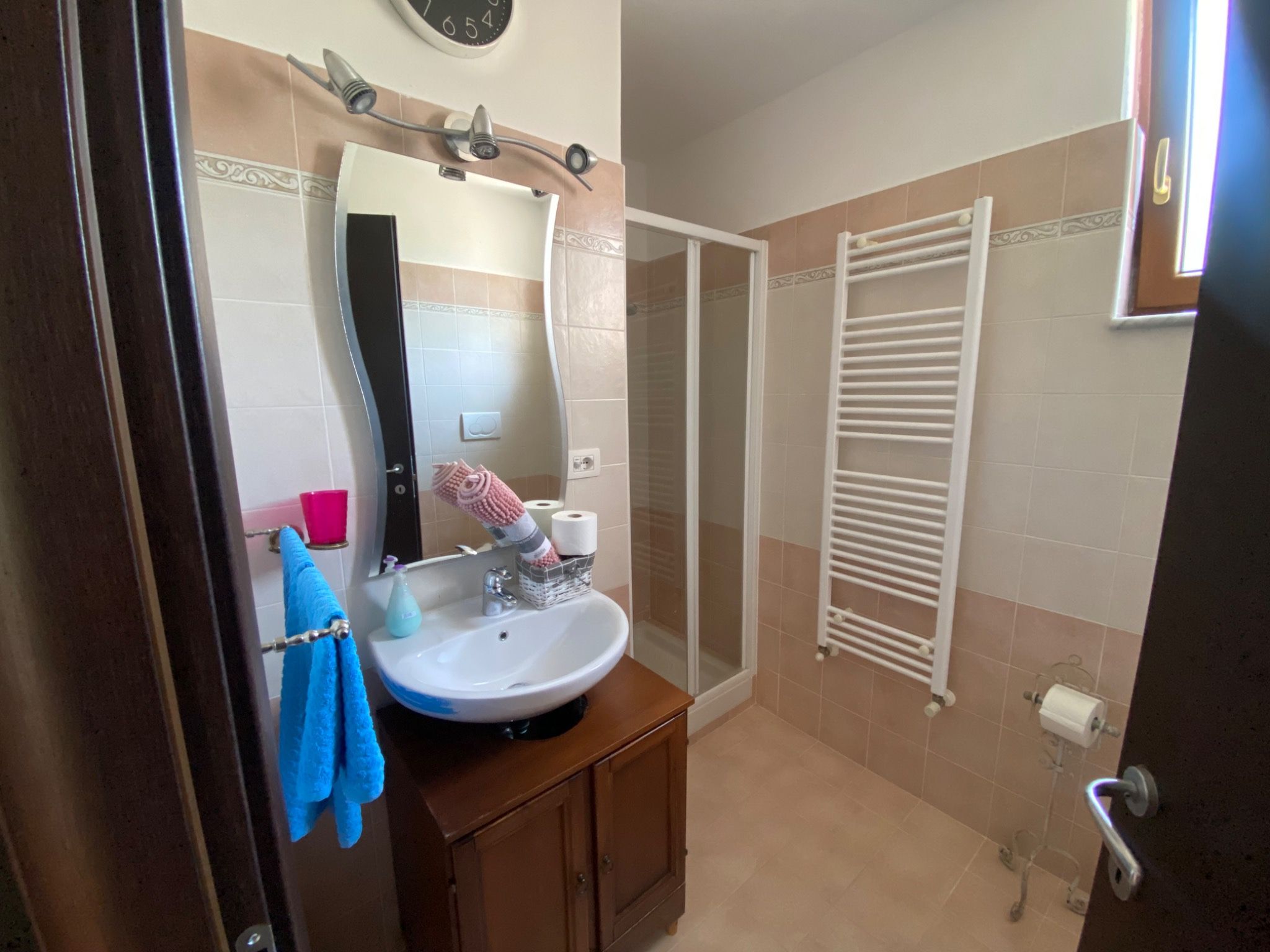 Bright bathroom with shower and window